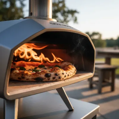 A close-up of a Gozney Roccbox portable pizza oven actively cooking a Neapolitan-style pizza with flames visible at the back, emphasizing the rolling flame technology.