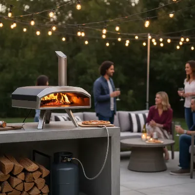 A sleek multi-fuel pizza oven set up in a modern backyard, with a visible gas tank connection and wood logs nearby, ready for a dinner party. The scene is inviting with ambient string lights and comfortable outdoor seating.